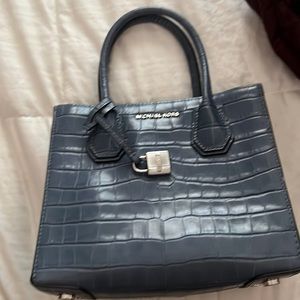 Michael Kors small blue purse with attachable strap. Never used.